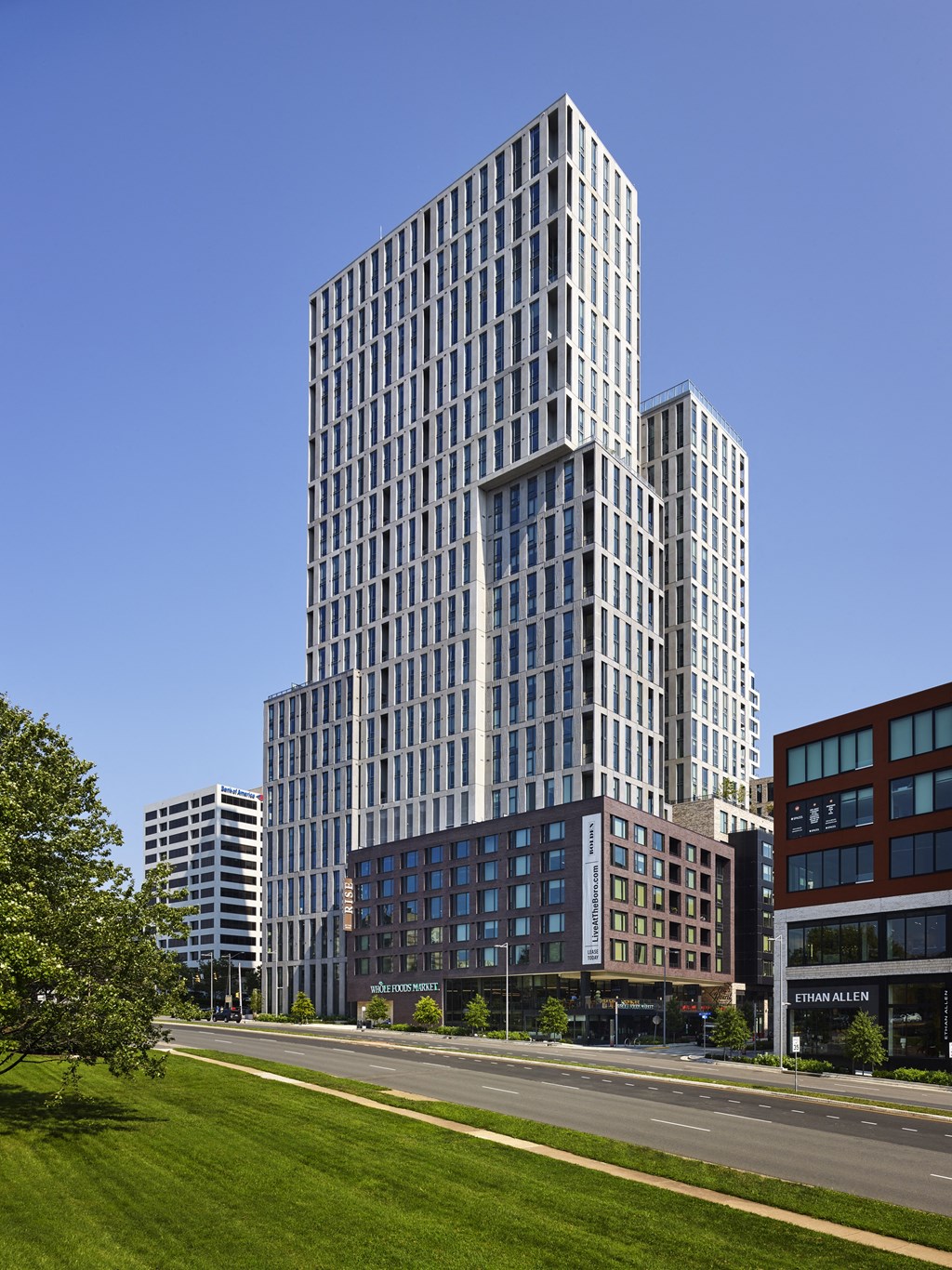 a cityscape with tall buildings and a street in the foreground at The Boro, Virginia, 22102