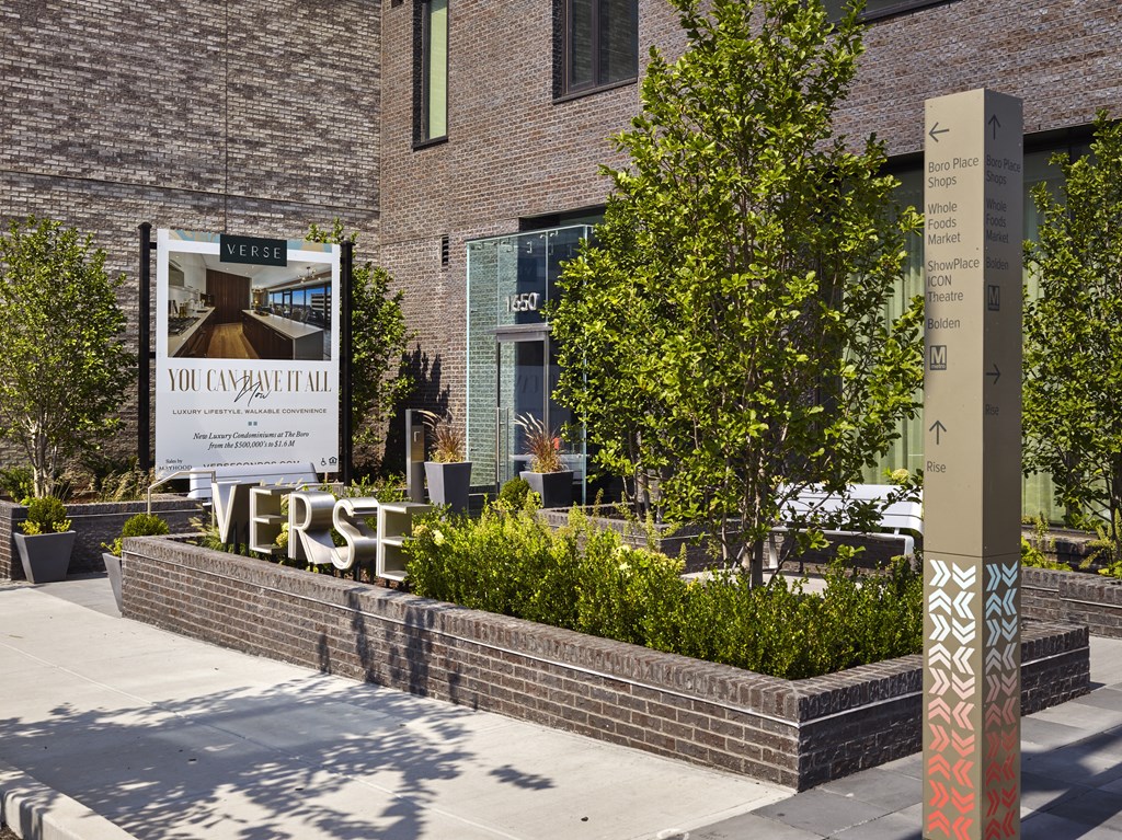 a large sign in front of a brick building at The Boro, Tysons