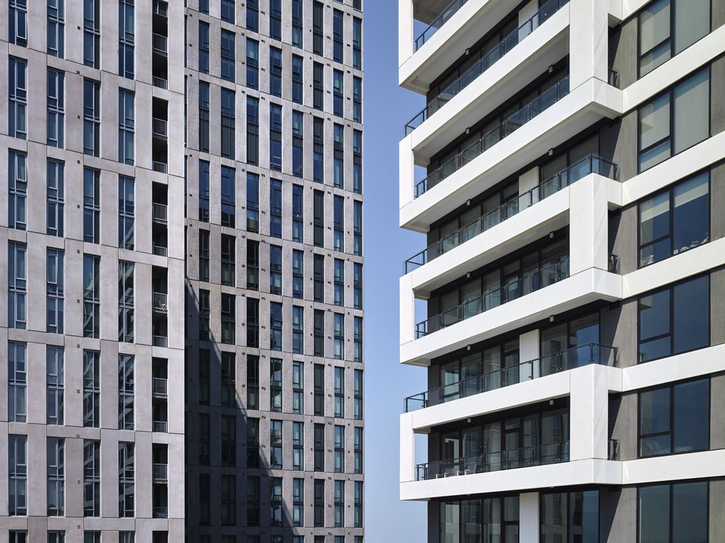 a close up of two tall buildings with balconies at The Boro, Tysons, VA