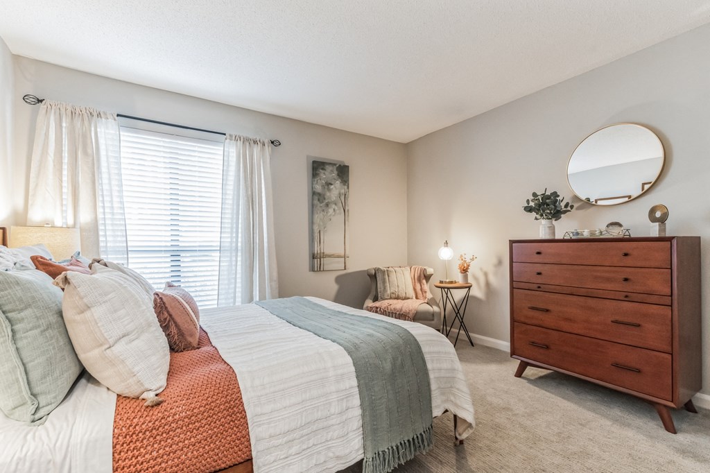 a bedroom with a bed and a dresser at Brampton Moors, Cary, NC