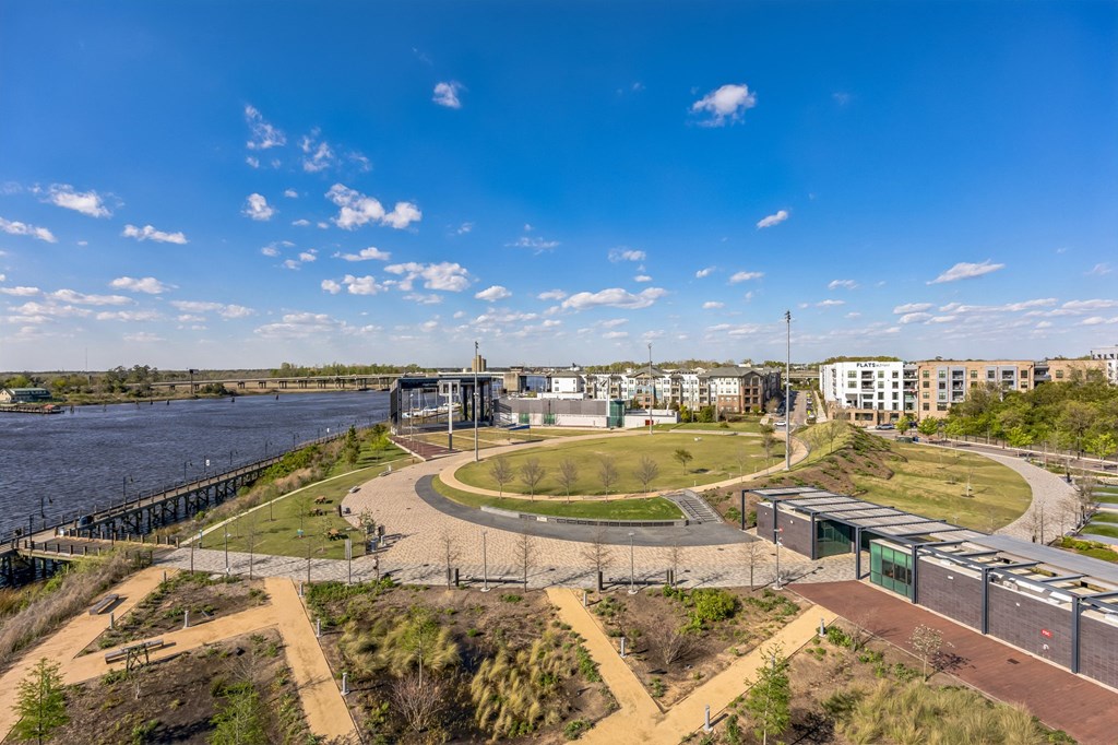 a view of a city with a river and buildings at Metropolitan at the Riverwalk, Wilmington, NC