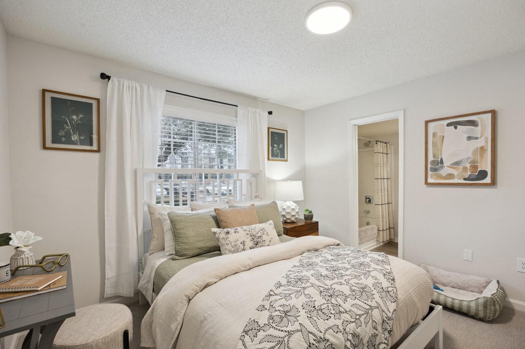a bedroom with a large bed and a window at St. Andrews Reserve, North Carolina, 28412