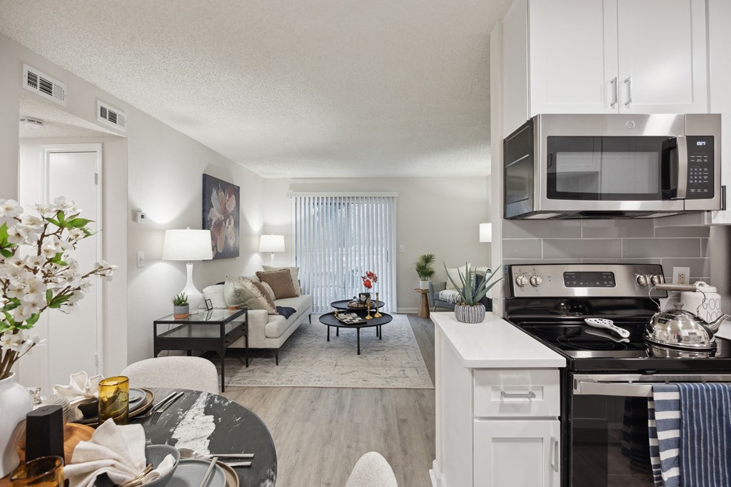 our apartments offer a spacious living room with a kitchen and dining area at St. Andrews Reserve, North Carolina, 28412