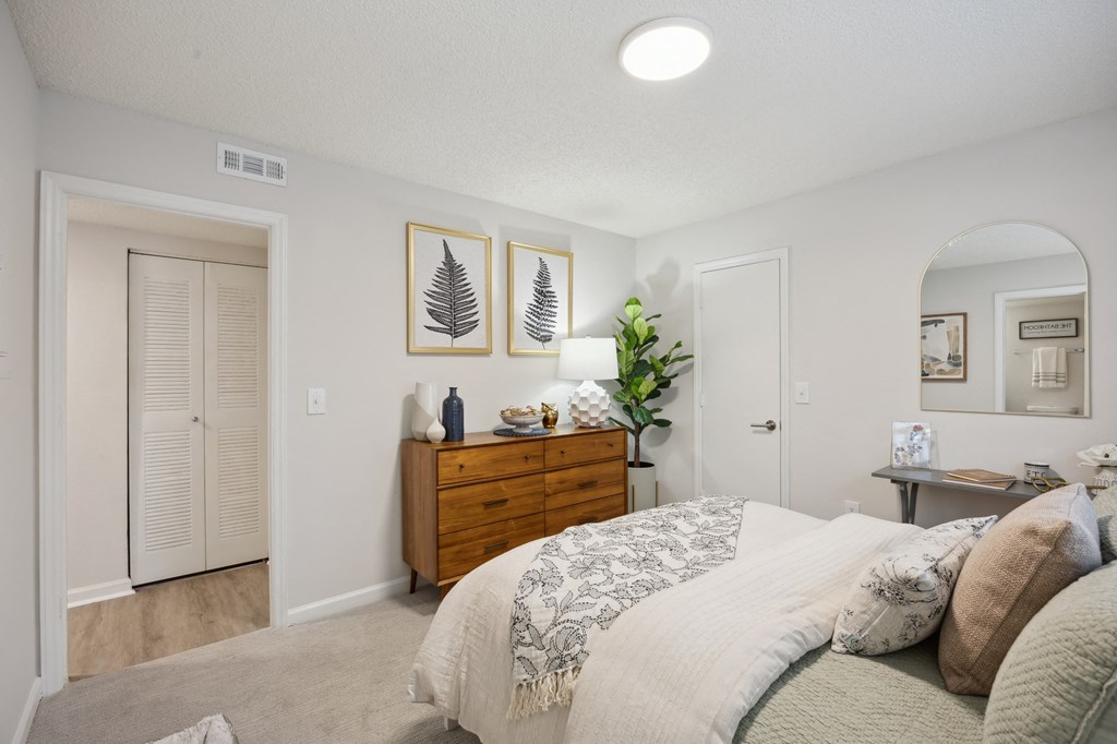 a bedroom with a bed and a closet at St. Andrews Reserve, North Carolina, 28412