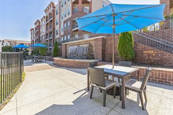 A Blue Umbrella is Above a Table at The Aster Apartments, Cary, North Carolina
