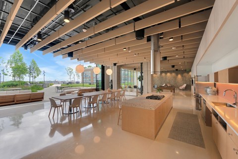 A modern kitchen with a dining table and chairs.