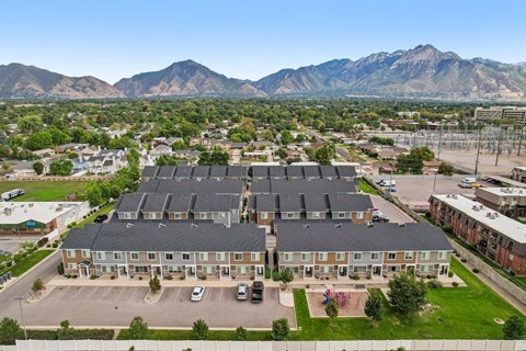 A large building with a parking lot in front of it.