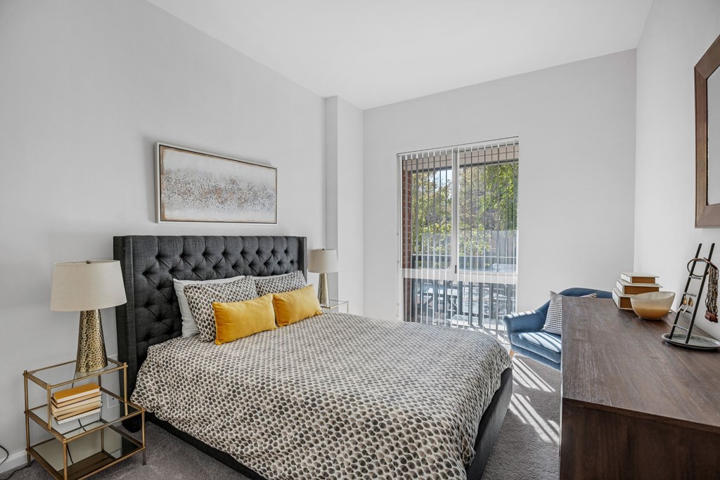 A bedroom with a large bed and a balconyat Lincoln Old Town, Alexandria, VA 22314