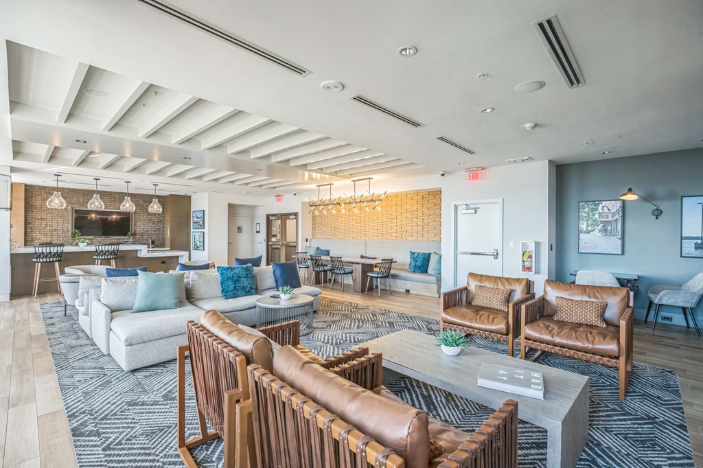 A spacious living room with a variety of seating options and a fireplaceat Lincoln Old Town, Alexandria, VA 22314