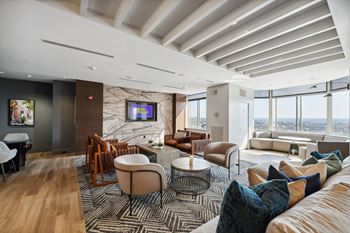 a living room filled with furniture and a large window at Lincoln Old Town, Alexandria Virginia