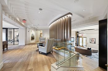 a large lobby with furniture and a staircase at Lincoln Old Town, Virginia
