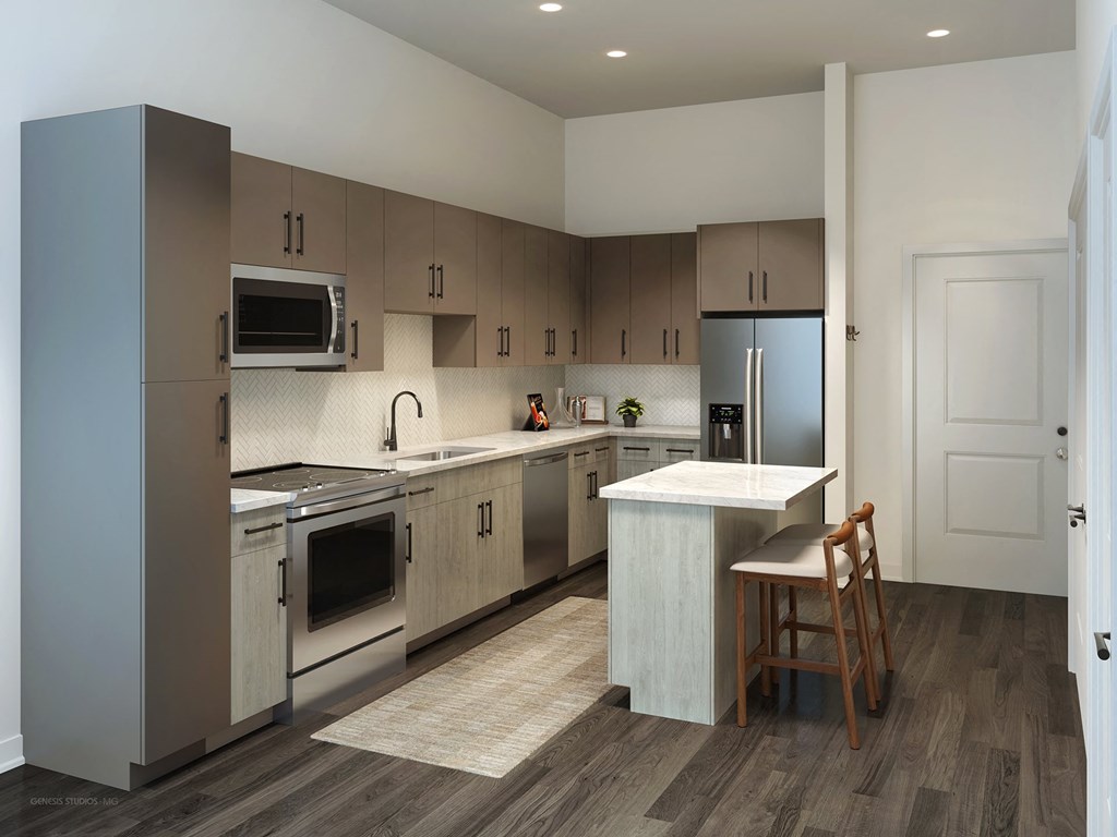 a kitchen with stainless steel appliances and a white counter top