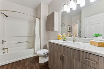 a bathroom with a toilet and a shower and a sink at Lincoln Old Town, Alexandria, VA