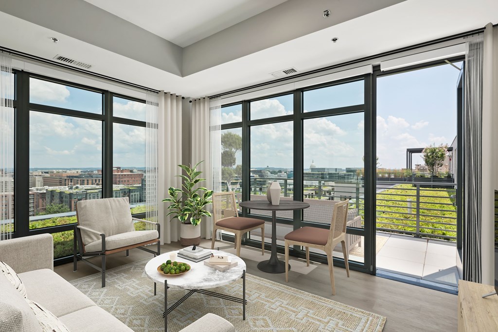 A living room with a view of the city.
