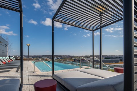 A pool area with a view of the city.