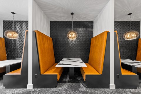 a dining room with orange booths and tables  at South and Hollis, North Carolina