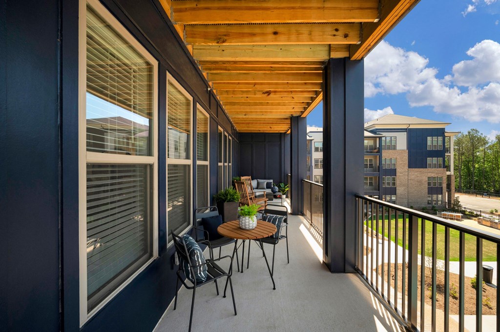 a patio with a table and chairs and a wooden roof at Preston Ridge, North Carolina