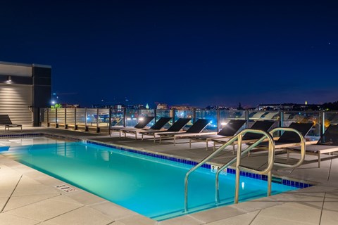 a swimming pool on the roof of a building at nightat The Chase at Bryant Street, District of Columbia