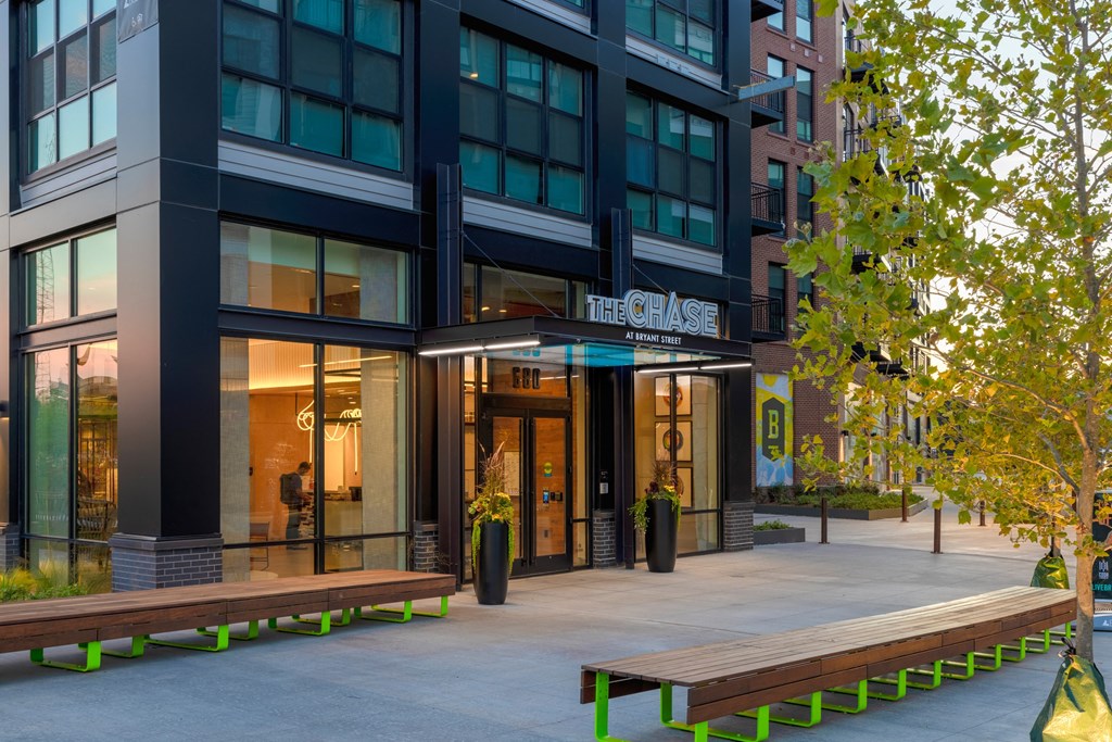 two benches in front of a building at The Chase at Bryant Street, Washington, 20002