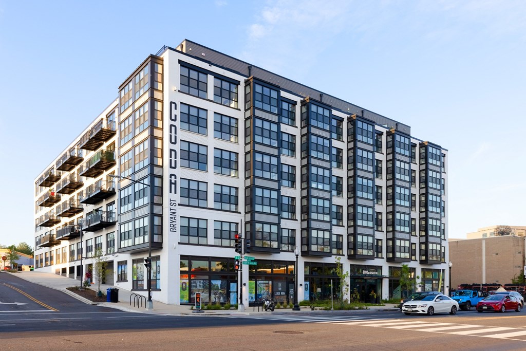 a large building on the corner of a city street at The Chase at Bryant Street, District of Columbia
