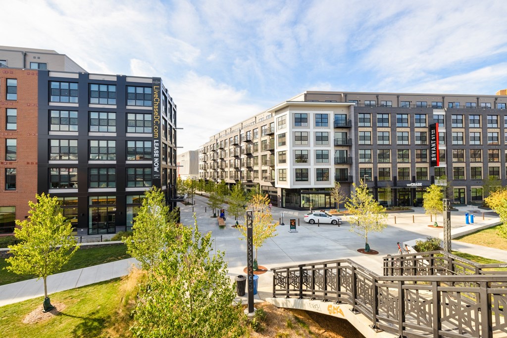 a view of a city street with buildings and a bridge at The Chase at Bryant Street, Washington