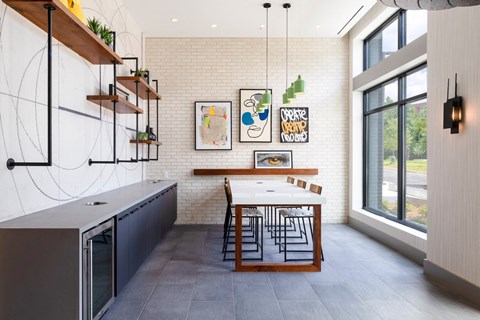 a kitchen with a dining table and a large window