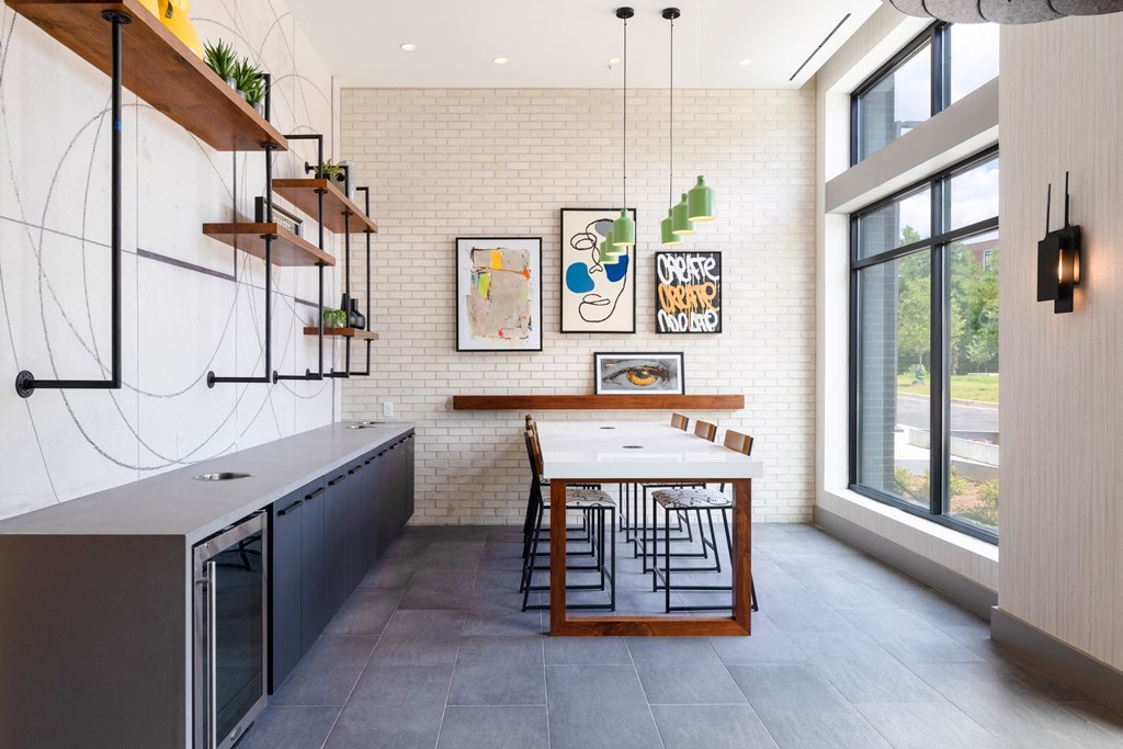 a kitchen with a long table and a large window a kitchen with a long table and a large window at The Chase at Bryant Street, Washington