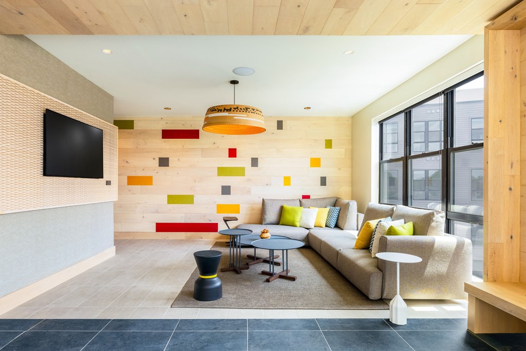 a living room with a couch and a table at The Chase at Bryant Street, Washington, 20002