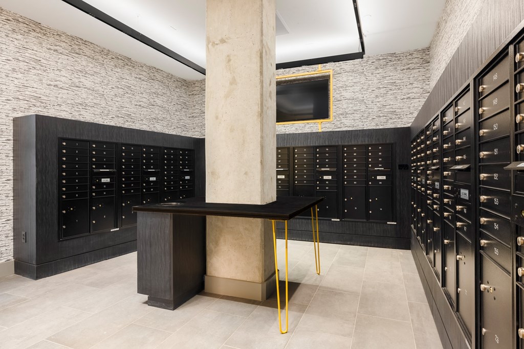 a wine cellar with racks and a table in the middle at The Chase at Bryant Street, District of Columbia, 20002