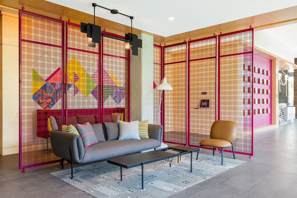 a living room with a couch and a coffee table in a lobby at The Chase at Bryant Street, District of Columbia, 20002