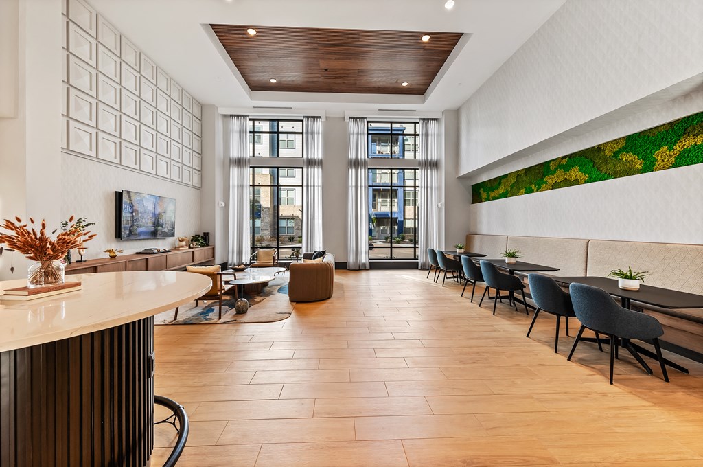 Clubhouse lounge and coworking space with couch and booths Preston Ridge Cary, NC.