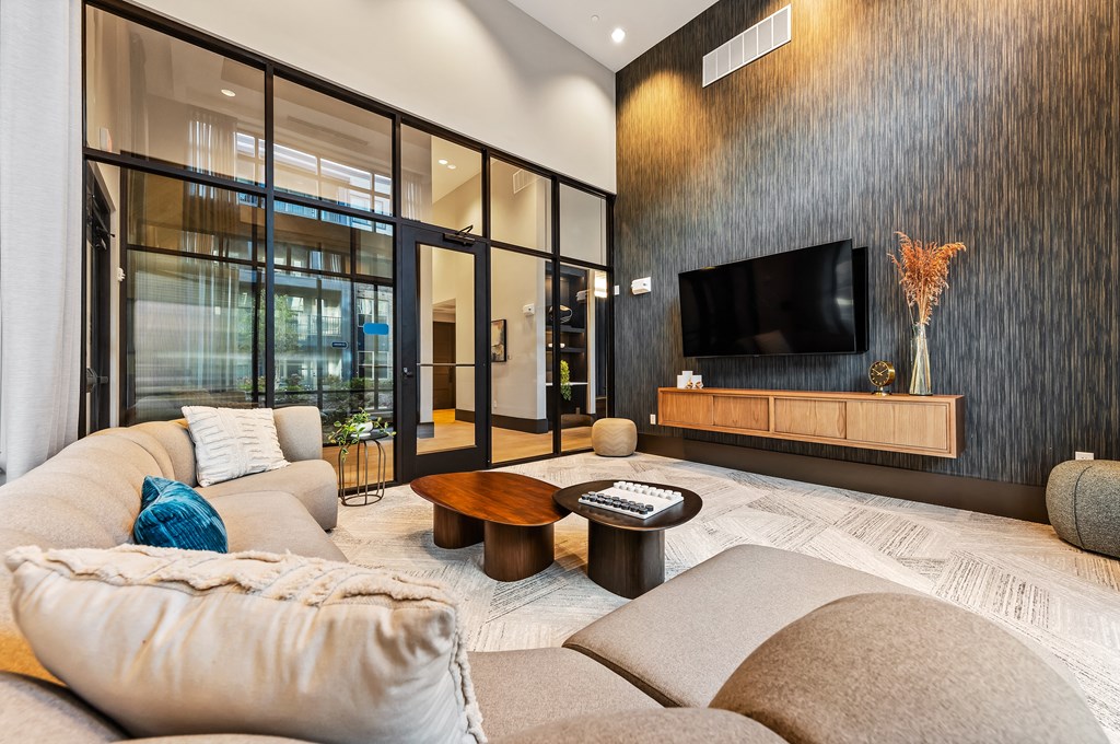 Private lounge with a flat screen TV mounted on the wall at Preston Ridge in Cary, NC.