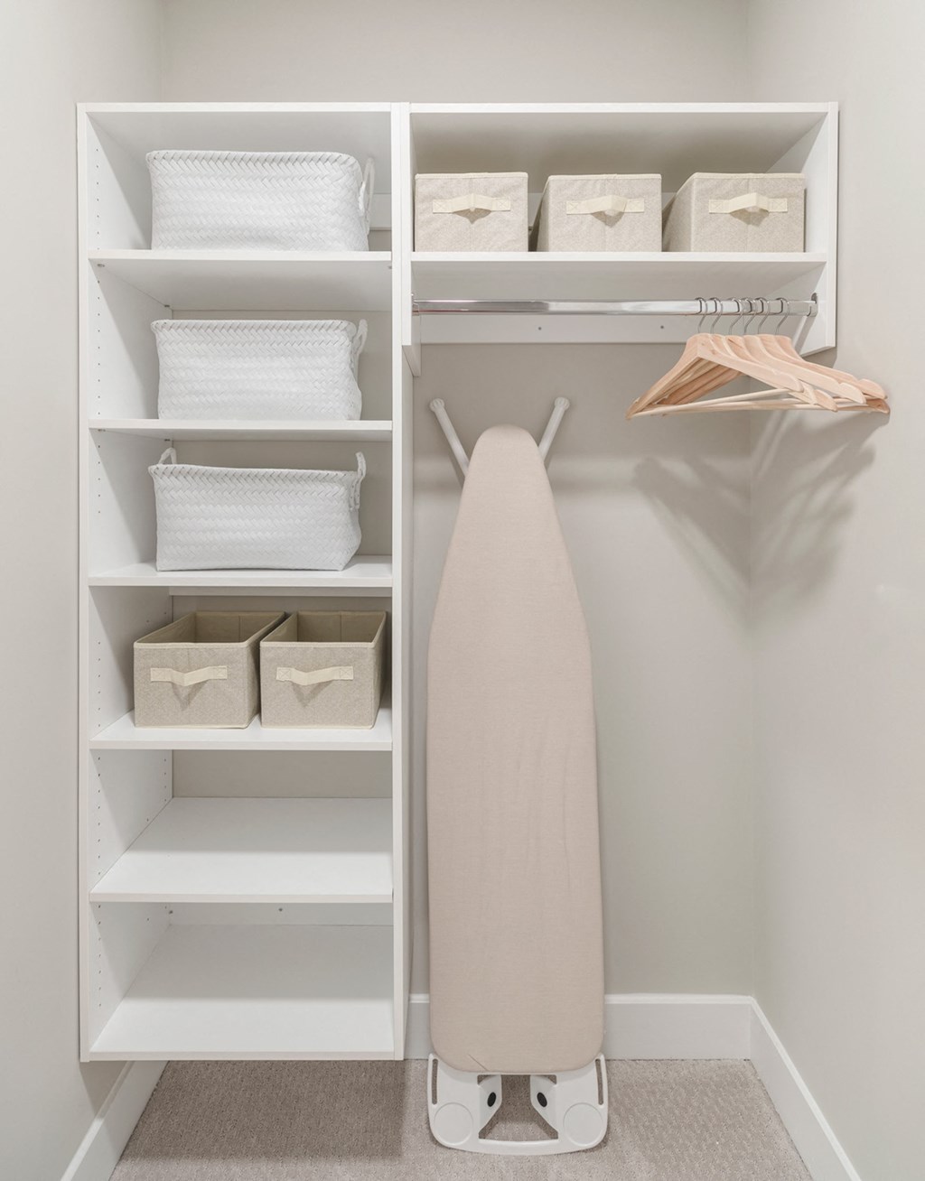 a walk in closet with shelves and a white shelf with a surfboard in it at Coda at Bryant Street, District of Columbia, 20002