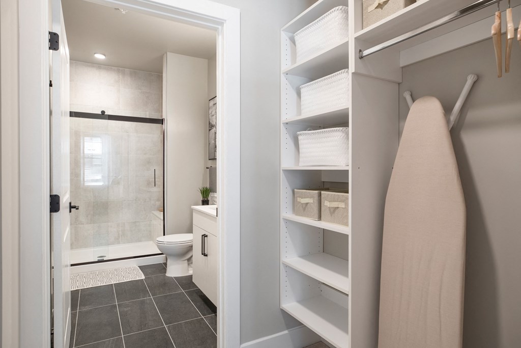 a bathroom with a shower and a towel rack in a closet at Coda at Bryant Street, Washington, 20002