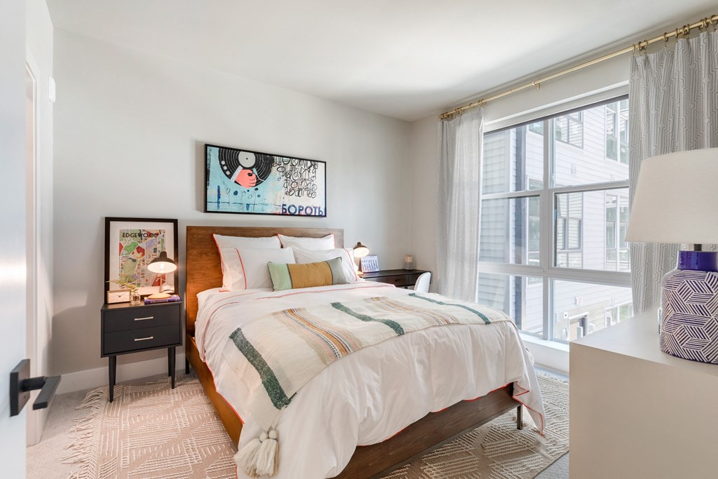 a bedroom with a bed and a large window at Coda at Bryant Street, Washington, DC