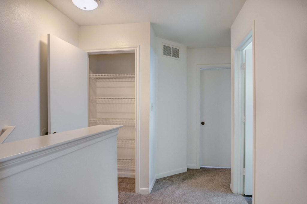 a bedroom with a large closet