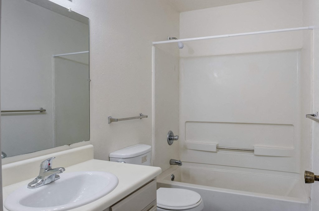 a bathroom with a sink toilet and bathtub
