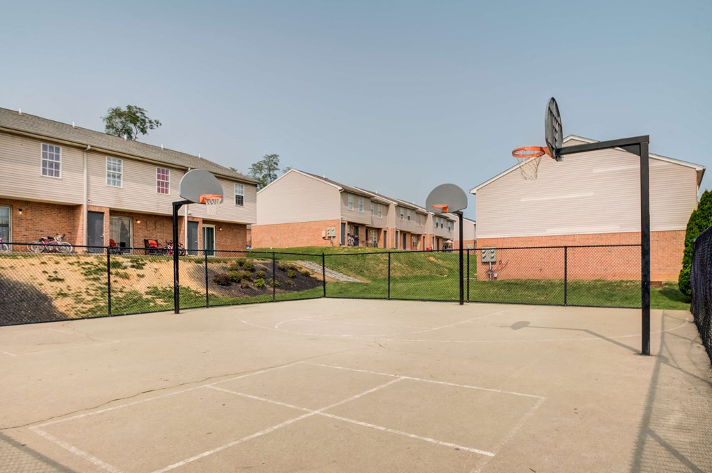 our basketball court is in front of our apartment buildings and has a basketball hoop