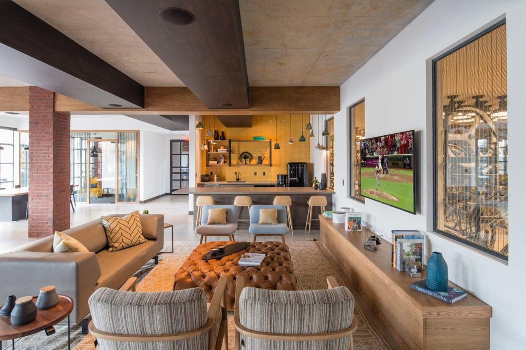 a living room with couches and chairs and a table