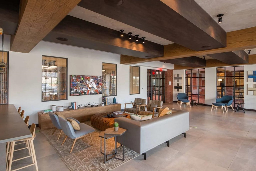 a living room with a couch and chairs and a table