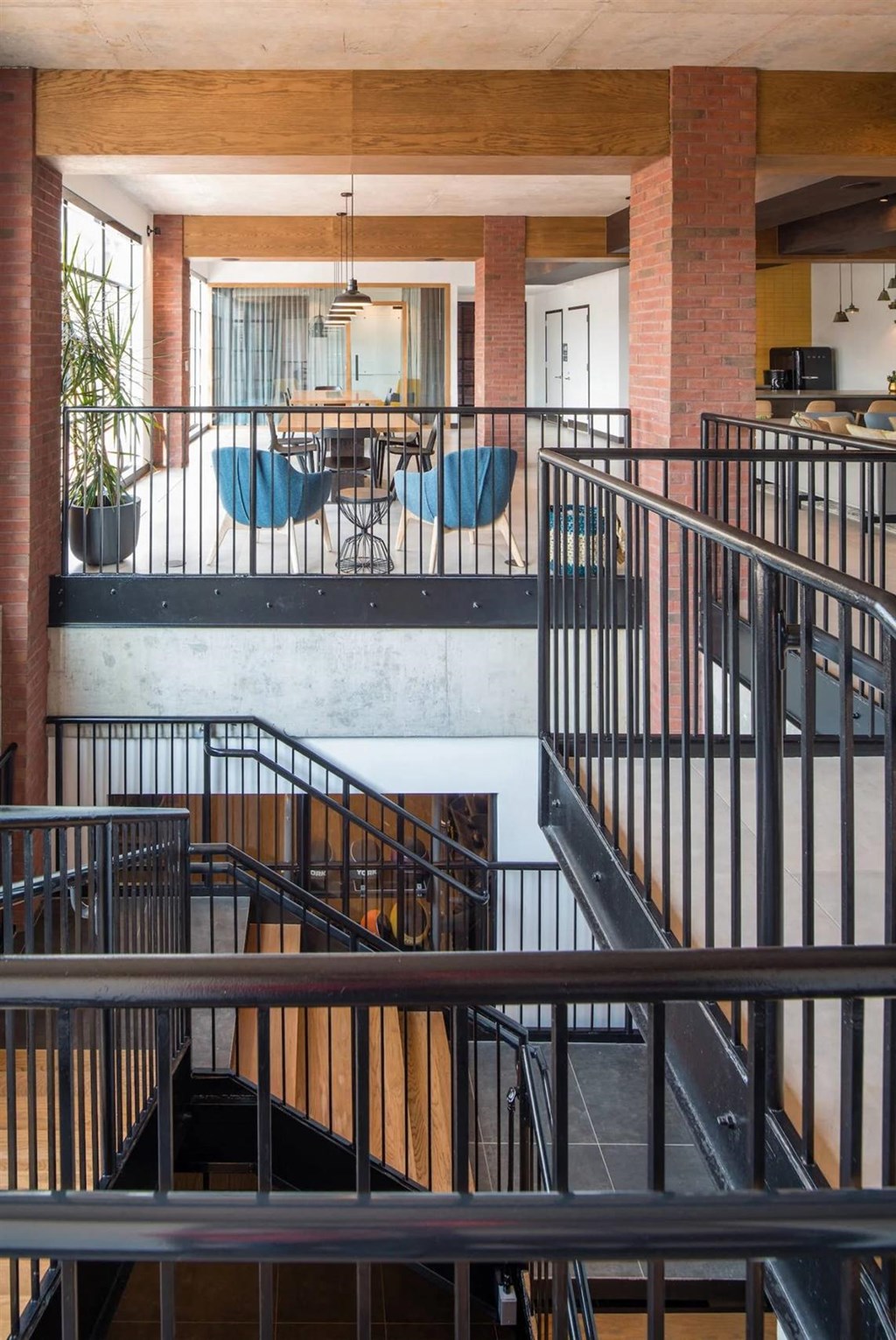 the interior of a building with stairs and a dining room
