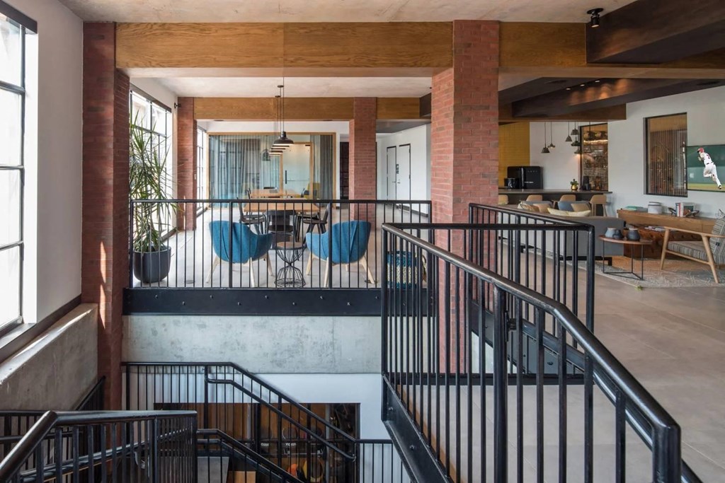 a view of the living room from the second floor of a house