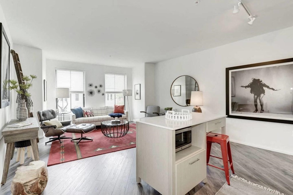 an open living room with a counter and a living room