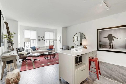 an open living room with a counter and a living room