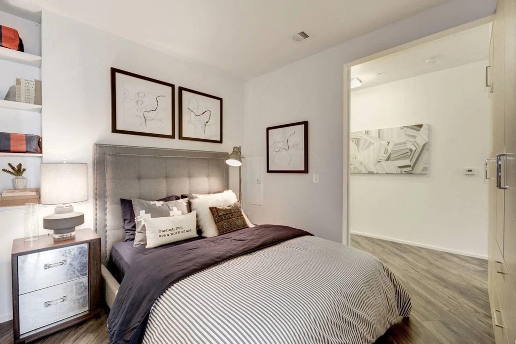 a bedroom with a bed and a closet