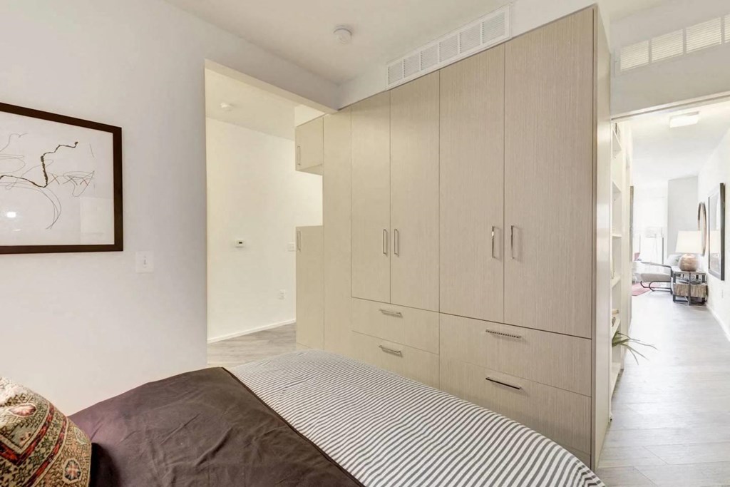 a bedroom with a bed and a closet