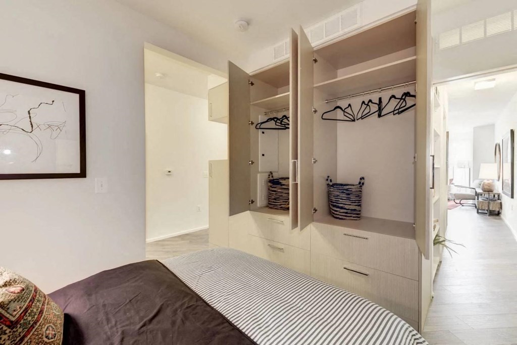 a bedroom with a bed and a closet