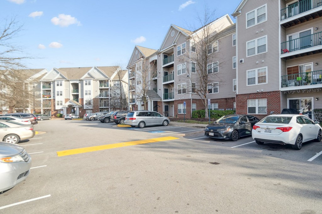 an empty parking lot in front of an apartment building at The Fields at Lorton Station, Virginia, 22079