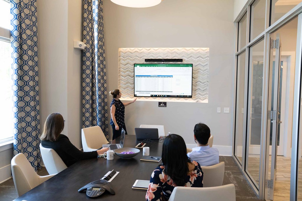 A Woman is Giving a Presentation at The Aster Apartments, Cary, 27519