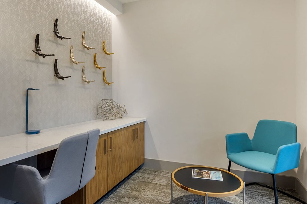 a room with two chairs and a table at Delamarre at Celebration, Celebration